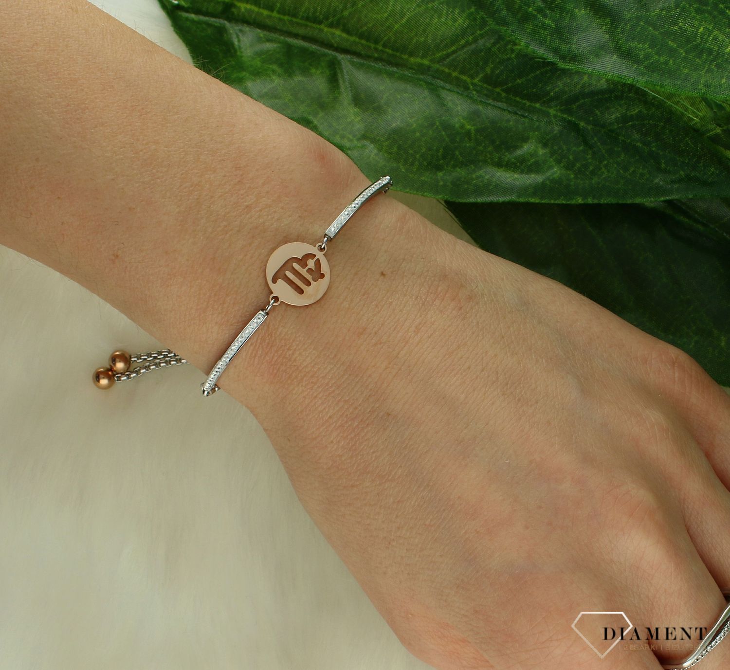 Bransoletka damska znak zodiaku Panna Nomination Italy Milleluci rosegold 028014 006 z kolekcji Zodiaco. Wykonana ze stali szlachetnej, zdobiona mieniącymi się, błyszczącymi cyrkoniami pave oraz zawieszką ze znakiem zodiaku PANNA w kolorze różo.jpg